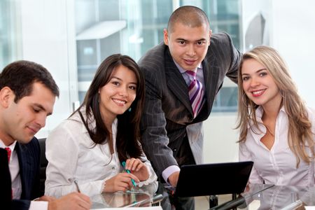 Young business team at the office smiling