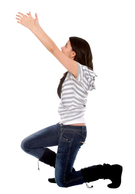 Woman on her knees holding an imaginary object - isolated