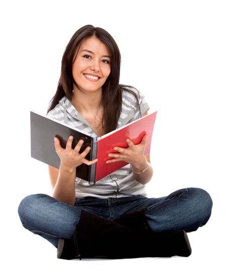 Female student smiling with a notebook - isolated over white