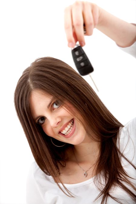 Woman holding some car keys isolated on white