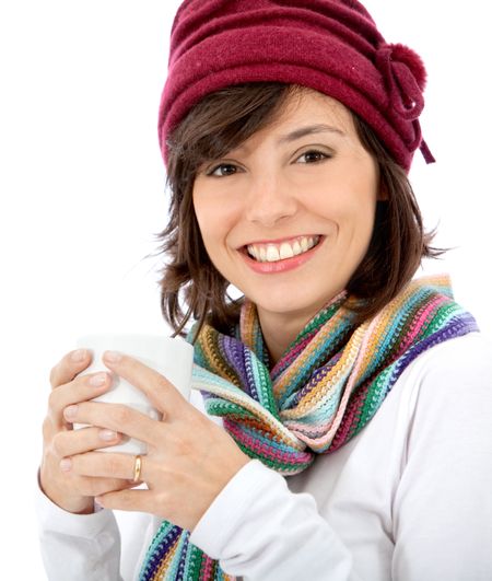 Happy woman with winter clothes isolated over a white background