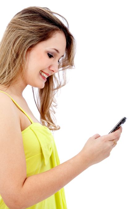 Woman texting on her cell isolated over a white background