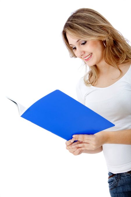 Beautiful female student reading isolated over a white background