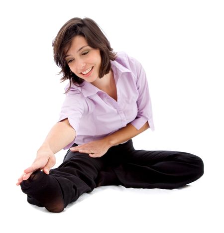 Business woman stretching isolated over a white background