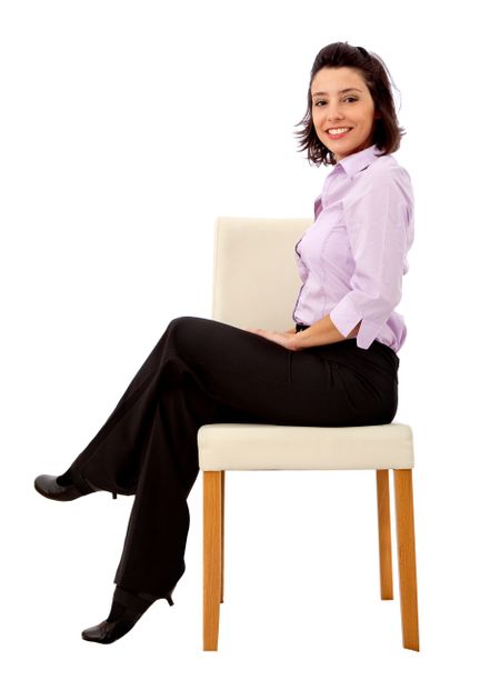 Business woman sitting in a chair isolated on white
