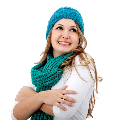 Woman wearing winter clothes isolated over a white background