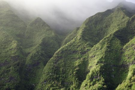 Hawaiian landscape: mountainsides on misty morning on Oahu