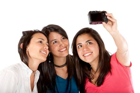 Girls taking a picture of themselves isolated on white