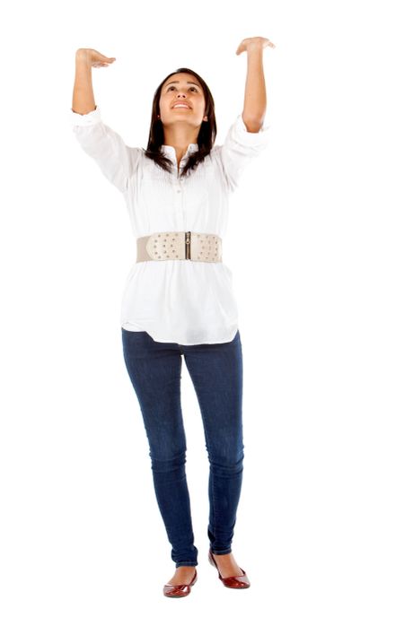 Casual woman lifting an imaginary object isolated on white