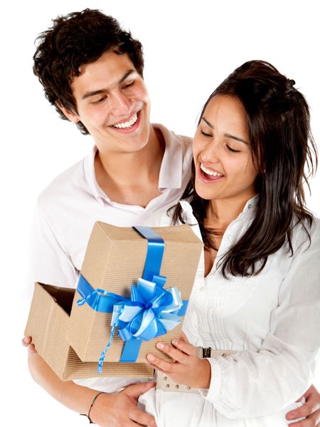 Young man giving his girlfriend a present isolated over a white background