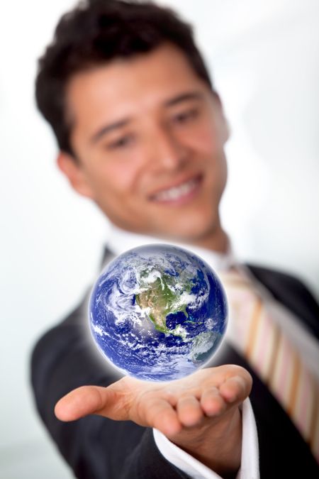 Business man with the world in his hands isolated over a white background