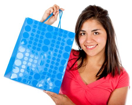 Girl holding a blue shopping bag isolated on white