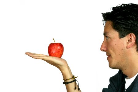 casual guy looking at an apple