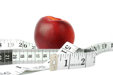 peach with measuring tape - diet