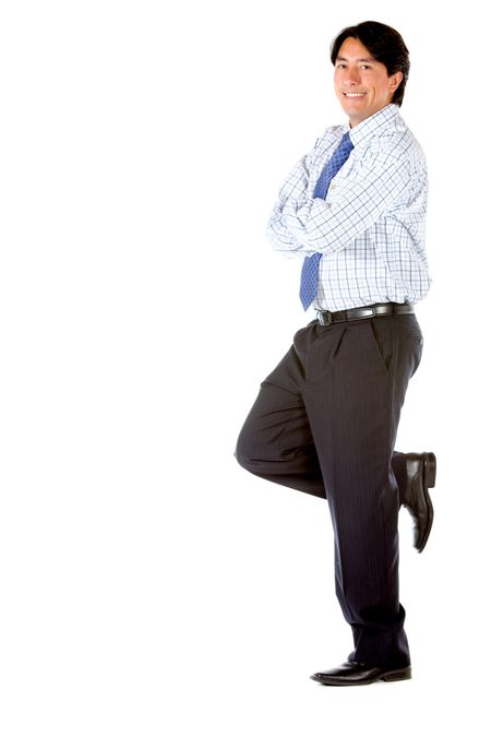 Business man leaning on a wall isolated over a white background