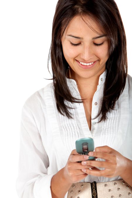 Woman texting on her cell isolated over a white background
