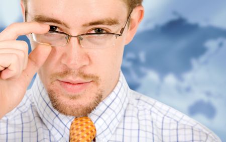 business man portrait with glasses in a corporate environment