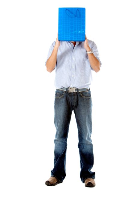 man covering his face with a shopping bag - isolated over white