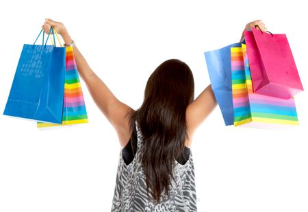 Back of a shopping woman with bags isolated over a white background