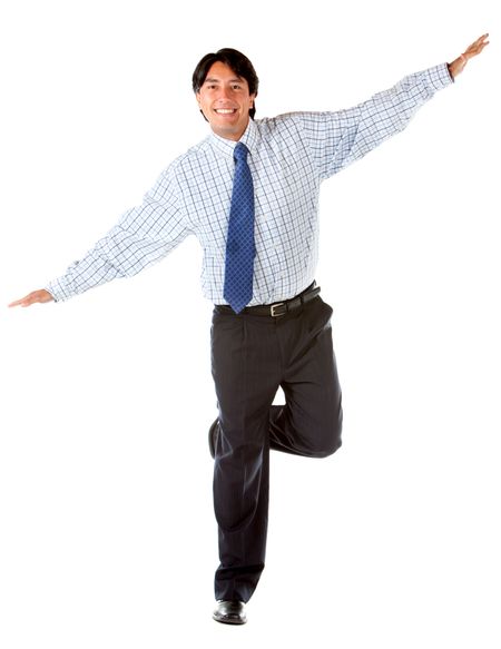 Business man keeping balance isolated over a white background