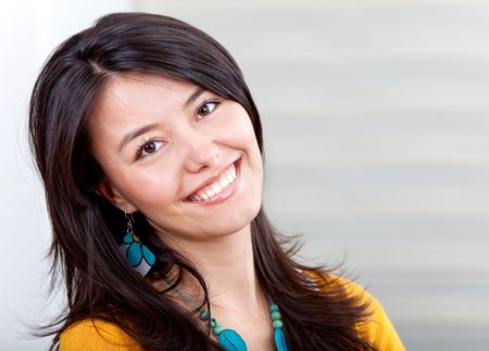 Beautiful casual woman portrait indoors and smiling