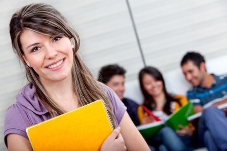 Female student with a group behind isolated over a white background