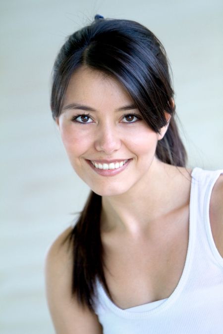Beautiful woman portrait at the gym smiling
