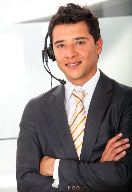 Man wearing a headset at the office - Business concepts
