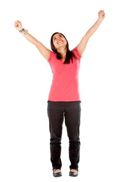successful girl looking happy with her arms up isolated on white