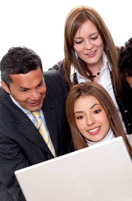 Business group with a laptop smiling - isolated over a white background