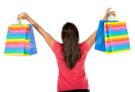 Back of a woman with shopping bags isolated over a white background