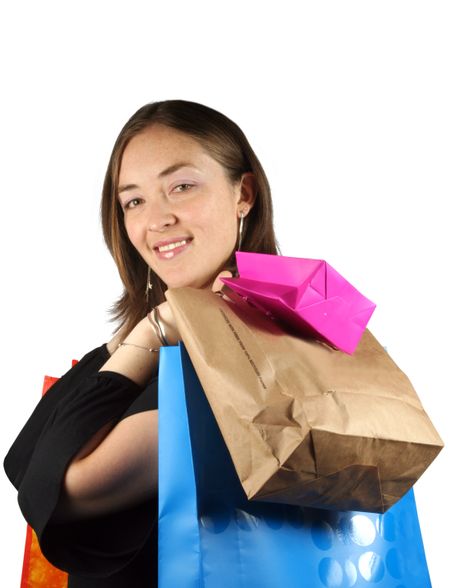 girl with bags smiling at the camera