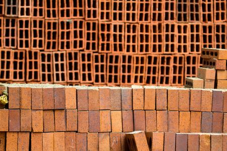Pile of bricks at a construction site - building material concepts