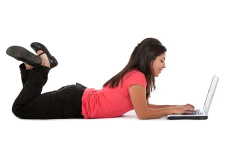 Woman with a laptop lying on the floor - isolated