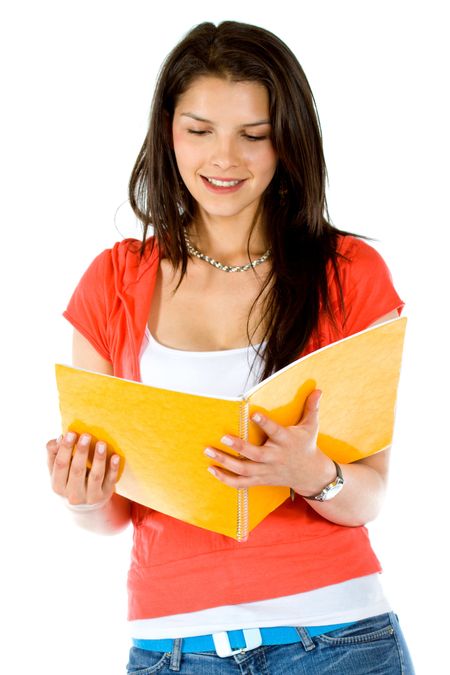 Female student reading a notebook isolated over a white background