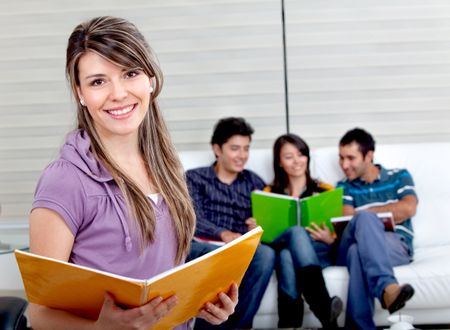 Beautiful female student with a group behind