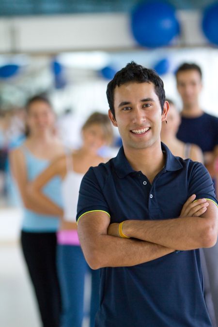 young-man-smiling-looking-happy-gym-47673709 young man smiling and looking happy at the gym