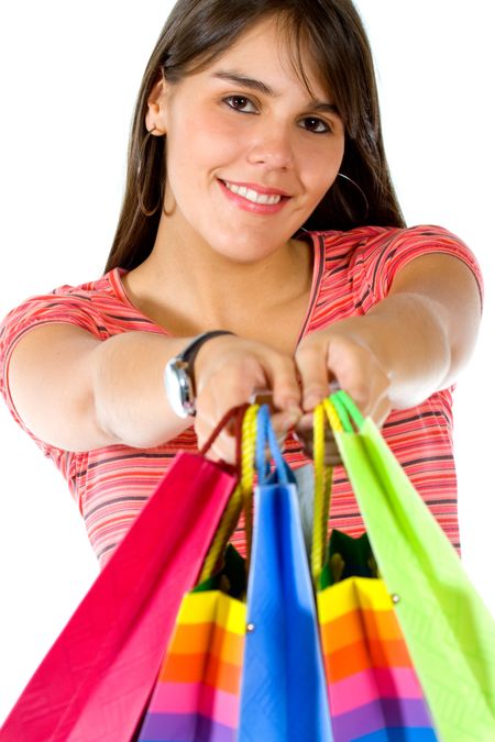 happy woman smiling with shopping over a white background