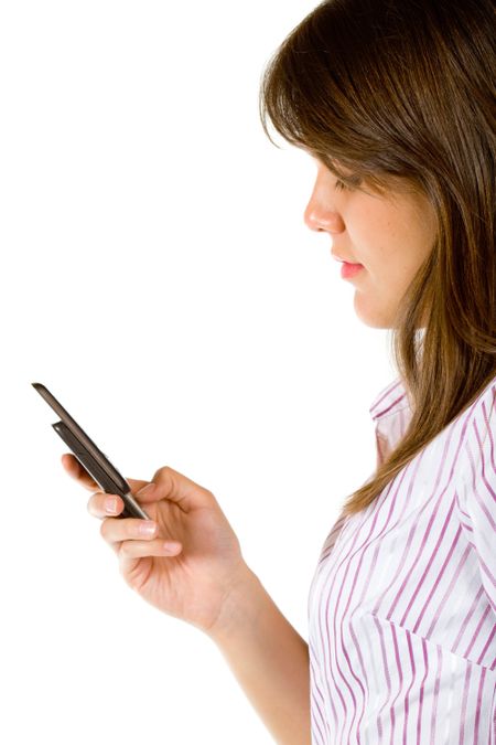Woman texting on her mobile phone isolated over a white background