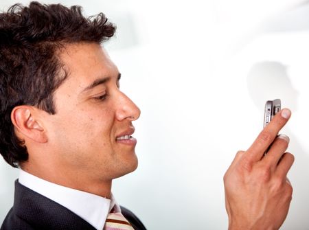 business man with a mobile phone in his office