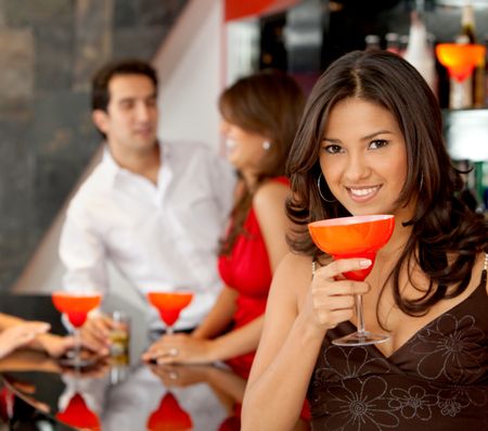 happy woman smiling in a bar or a nightclub