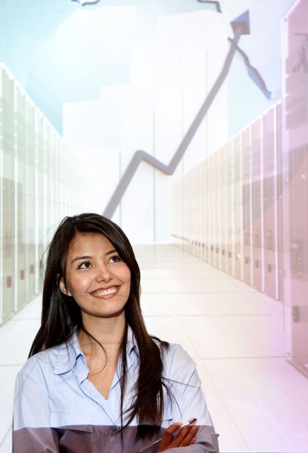 Business woman smiling in front of a company development projection