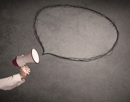 Caucasian business hand holding megaphone with drawn empty speech bubble