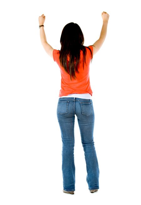 rear view of a successful girl looking happy with her arms up isolated
