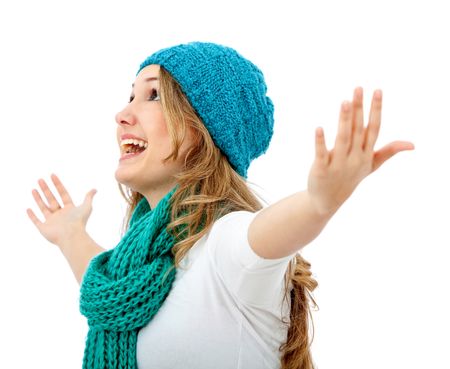 winter woman smiling full of success with her arms up isolated over a white background