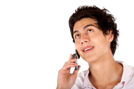 casual man looking up while talking on a mobile phone isolated over a white background
