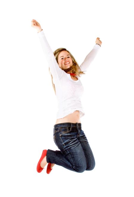 casual woman smiling and jumping full of joy isolated over a white background