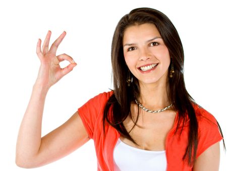 casual woman smiling and doing the ok sign isolated over a white background
