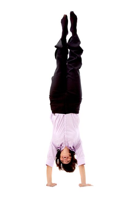 business woman doing the handstand isolated over a white background