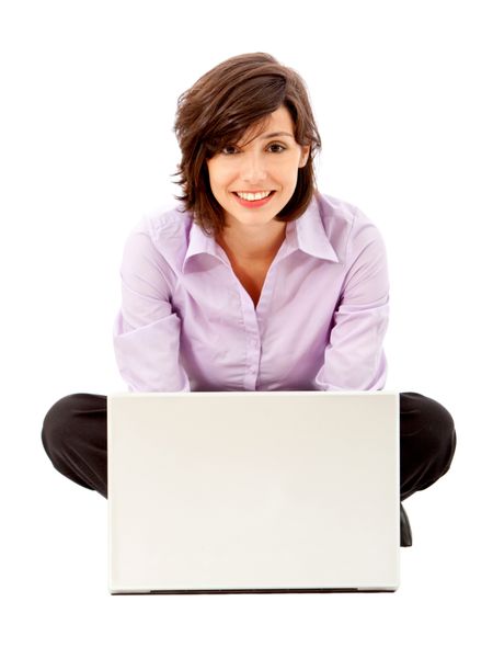 business woman looking happy on a laptop isolated over white